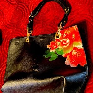 Great tote, spacious and comes with/long shoulder strap